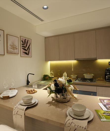 Interior fit out for modern kitchen with custom cabinetry, countertop installation and warm ambient lighting by Blueprint Experts