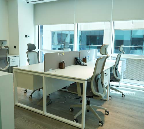 Bright and functional co-working space designed with ergonomic furniture and natural lighting.