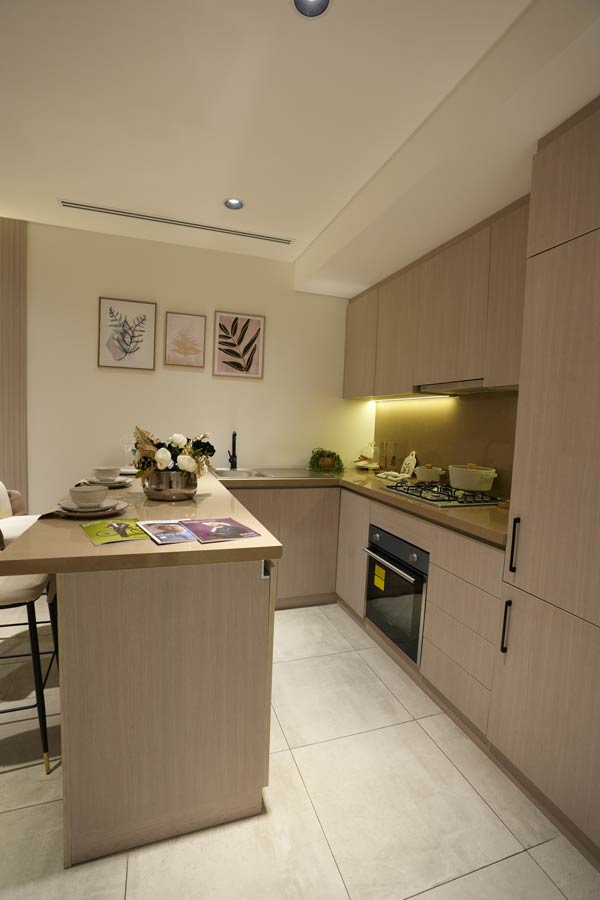 Stylish kitchen island setup with wine and dining arrangement by Blueprint Experts