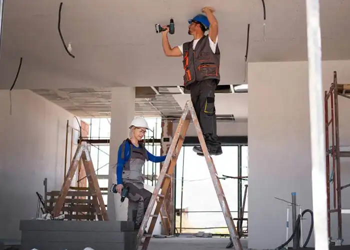 full shot man woman standing ladder