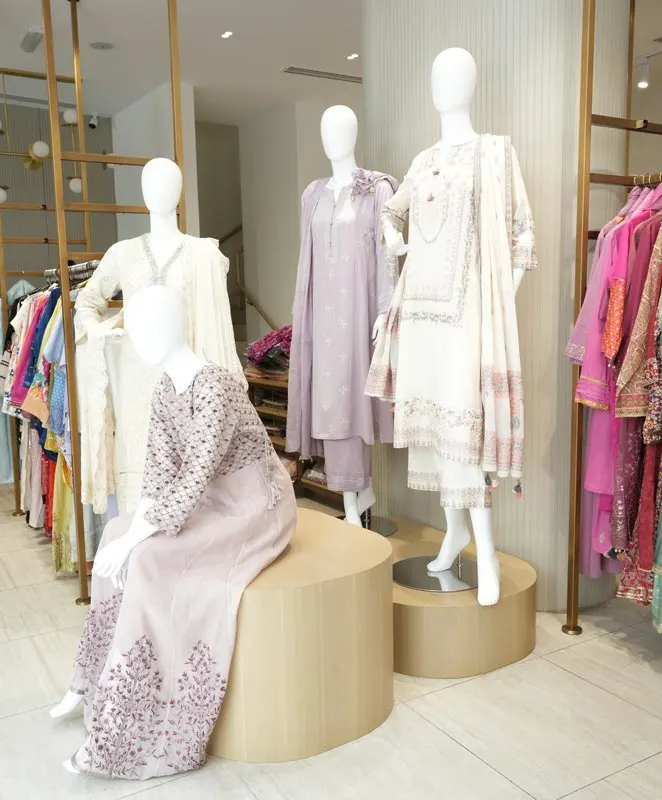 Retail store interior display with mannequins showcasing ethnic outfits by Blueprint Experts.