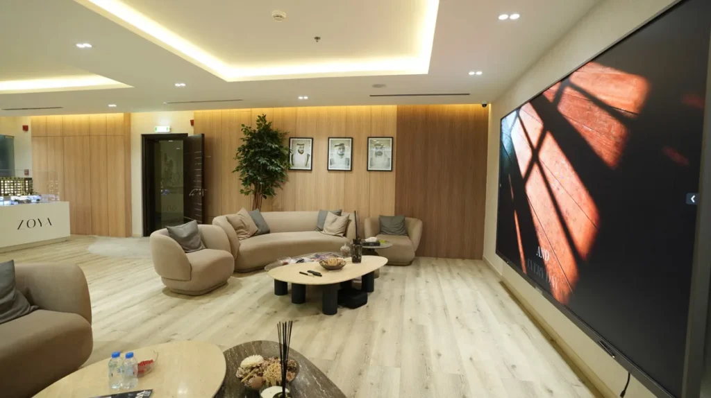Elegant apartment interior with wood-paneled wall and cozy seating area by Blueprint Experts.