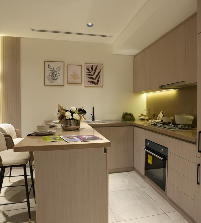 Modern residential kitchen interior design with wooden finish and built-in appliances by Blueprint Experts