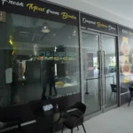 Restaurant fit out with glass façade, signage installation and modern entrance design by Blueprint Experts UAE