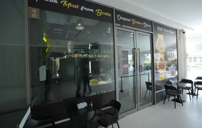 Restaurant fit out with glass façade, signage installation and modern entrance design by Blueprint Experts UAE