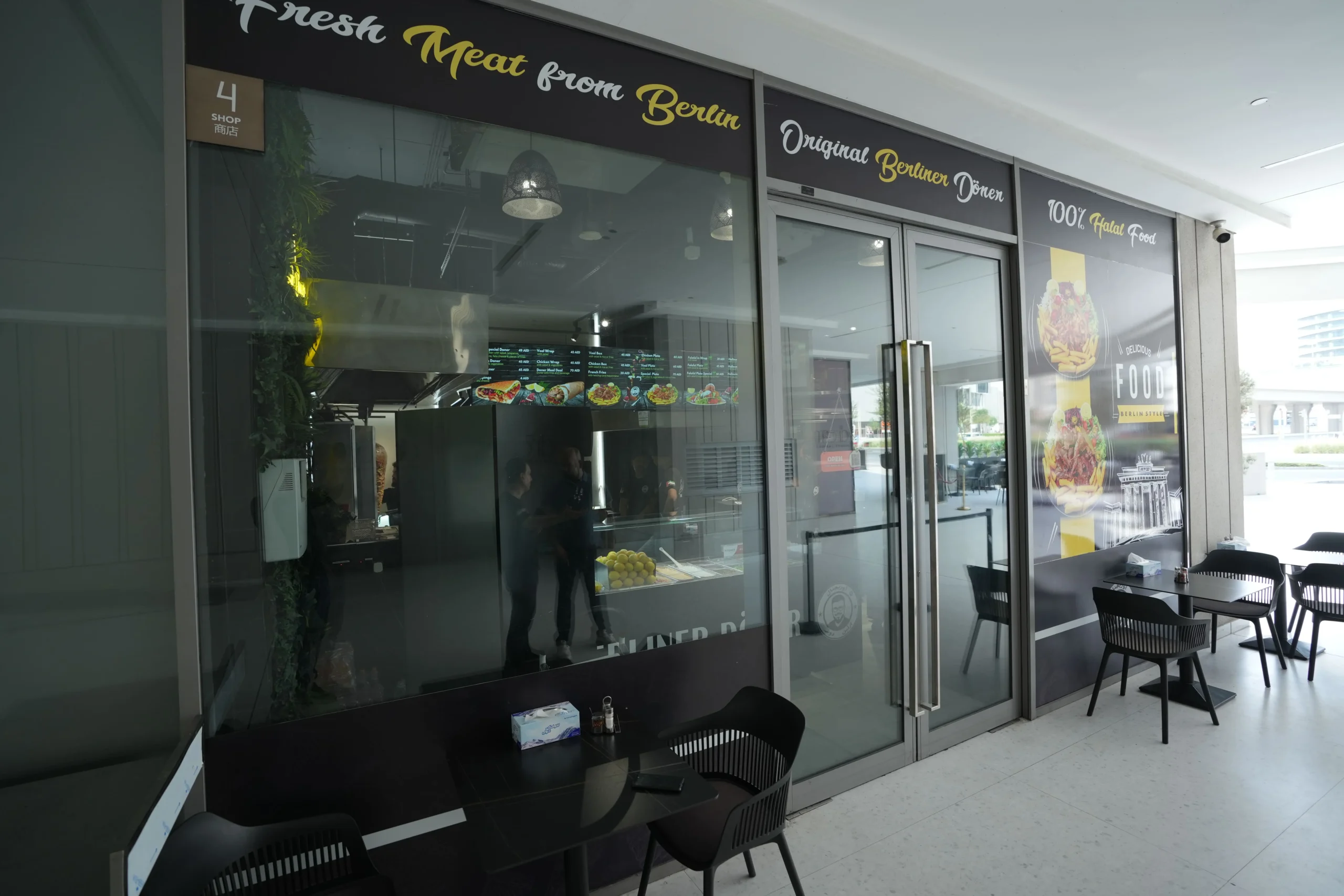 Restaurant fit out with glass façade, signage installation and modern entrance design by Blueprint Experts UAE
