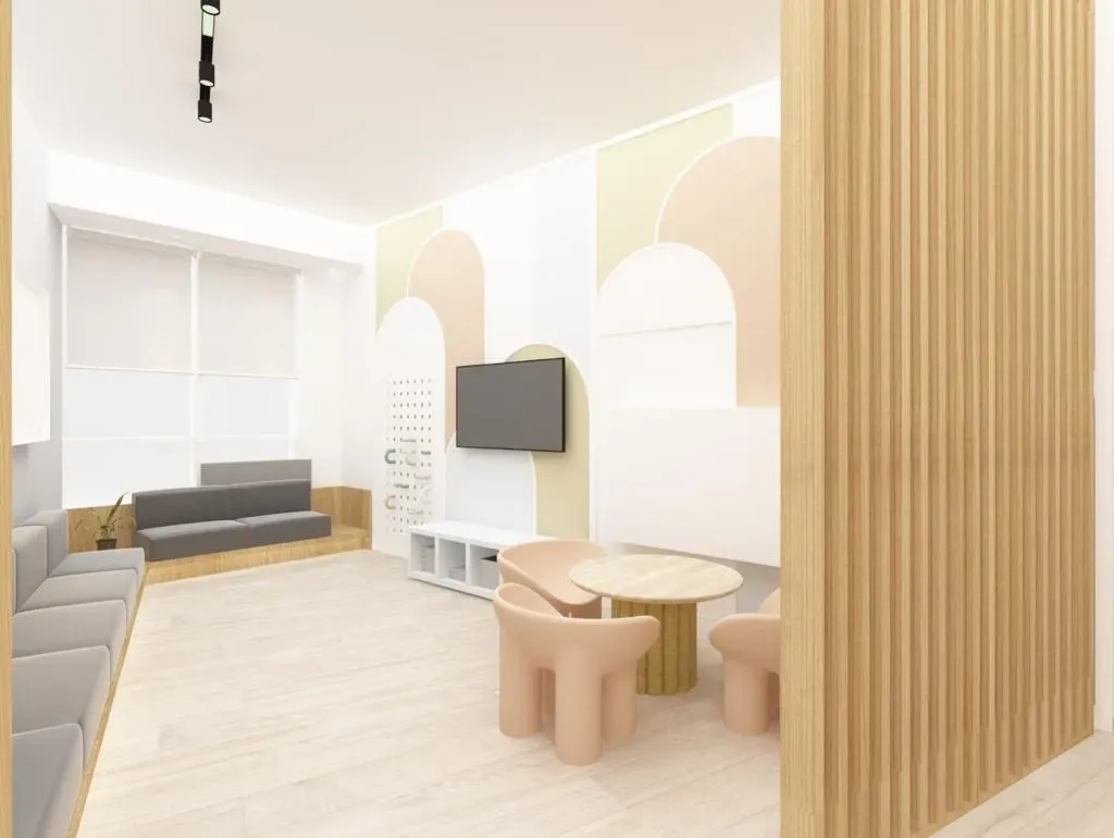 Stylish consultation room with beige seating, curved walls, modern lighting, and a soft neutral color palette for a professional healthcare environment.