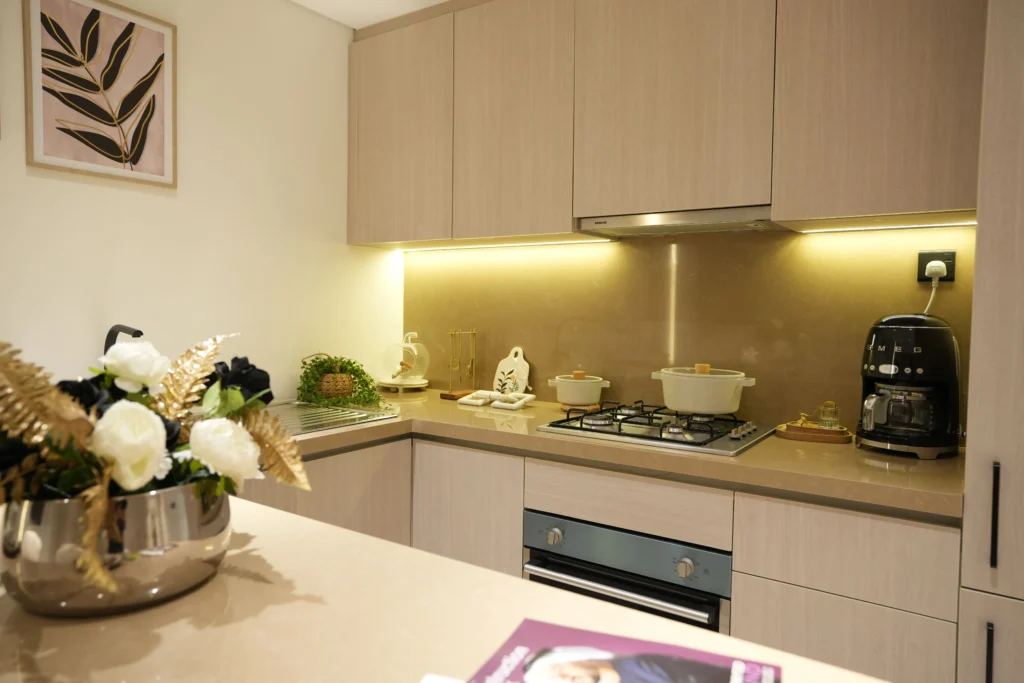 Contemporary modular kitchen interior with beige cabinetry, built-in stove, and premium countertop finishes by Blueprint Experts Dubai.