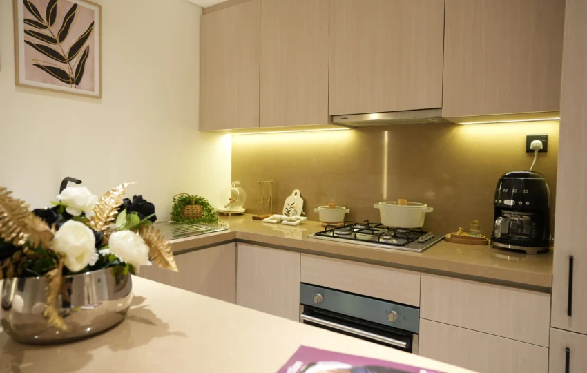 Contemporary modular kitchen interior with beige cabinetry, built-in stove, and premium countertop finishes by Blueprint Experts Dubai.