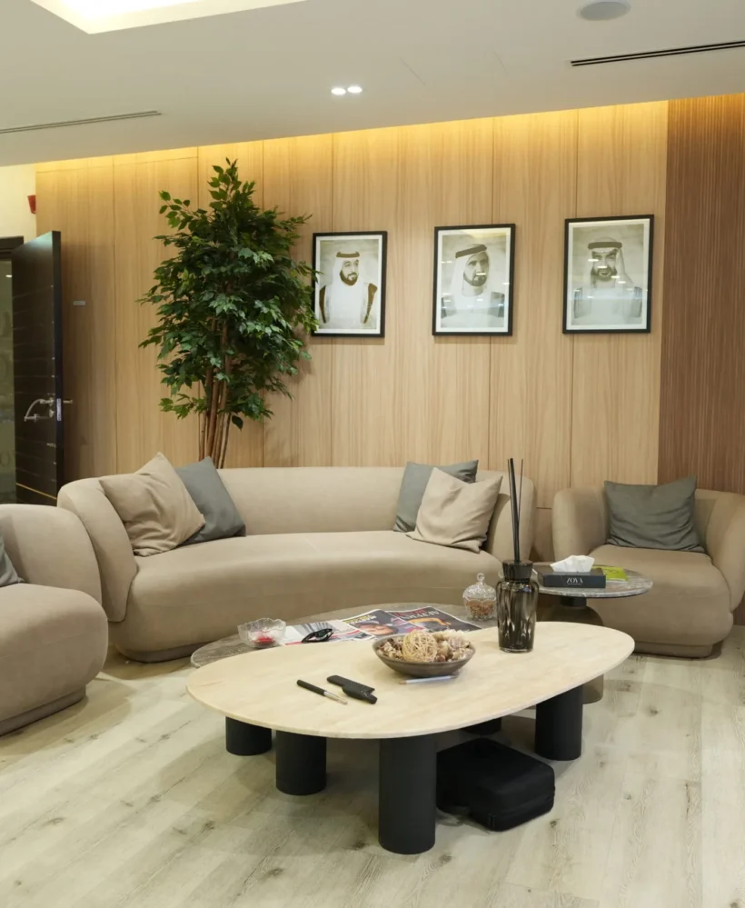 Modern corporate lounge interior fit out with bespoke furniture, wall paneling and reception seating by Blueprint Experts Dubai