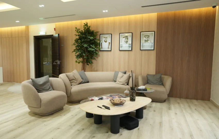 Modern corporate lounge interior fit out with bespoke furniture, wall paneling and reception seating by Blueprint Experts Dubai