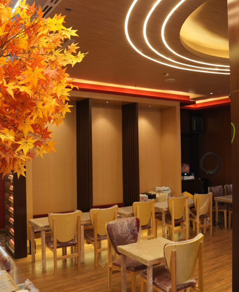 Restaurant fit out with thematic lighting, custom wood paneling and dining furniture installation by Blueprint Experts Dubai