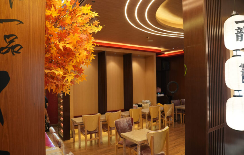 Restaurant fit out with thematic lighting, custom wood paneling and dining furniture installation by Blueprint Experts Dubai