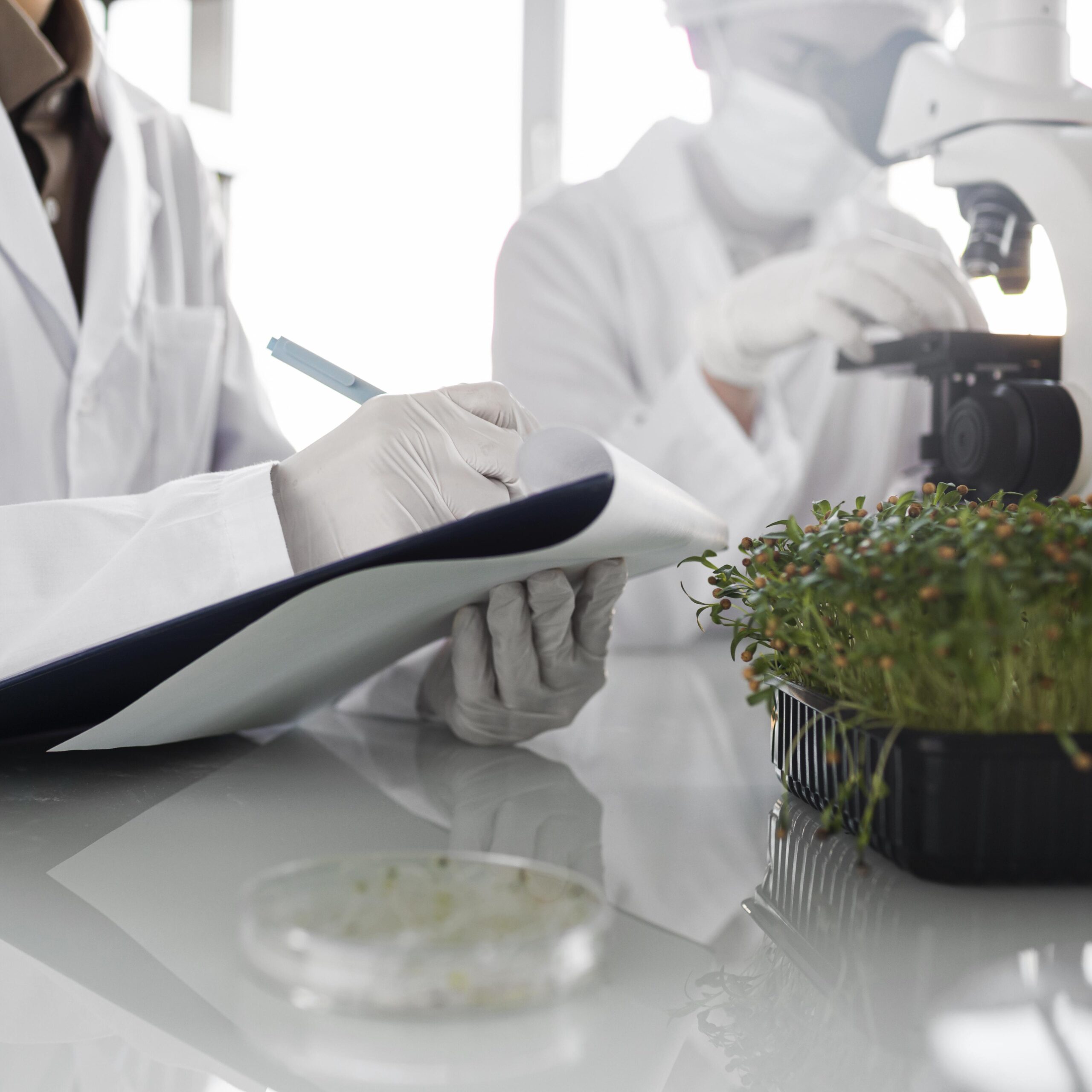 researchers-with-clipboard-biotechnology-laboratory